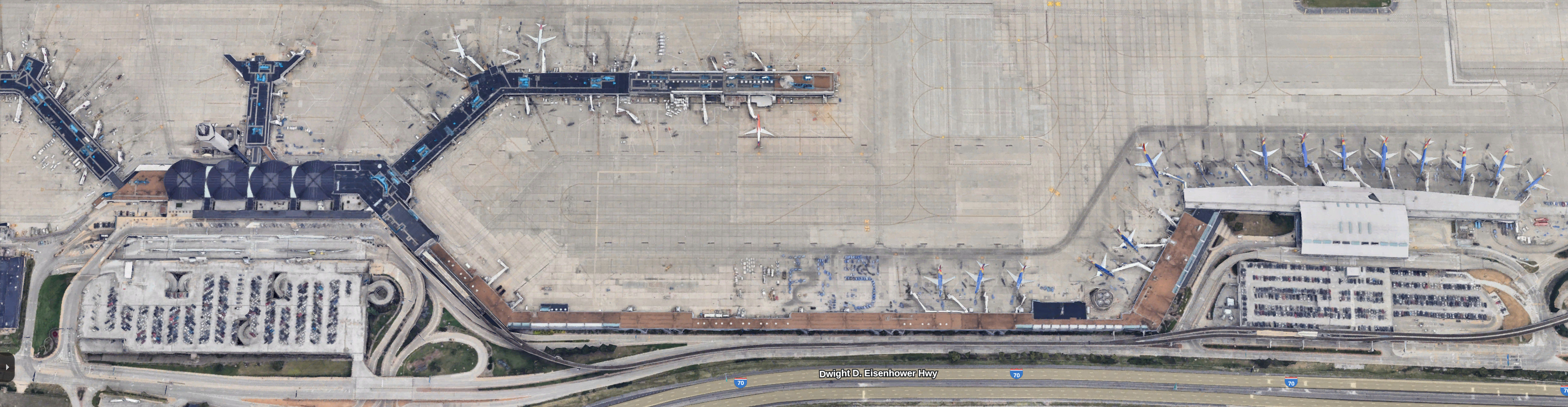 Overhead photo showing the long connection from terminal 2 to terminal 1, which is only accessible to employees since they never ended up using all the space they built